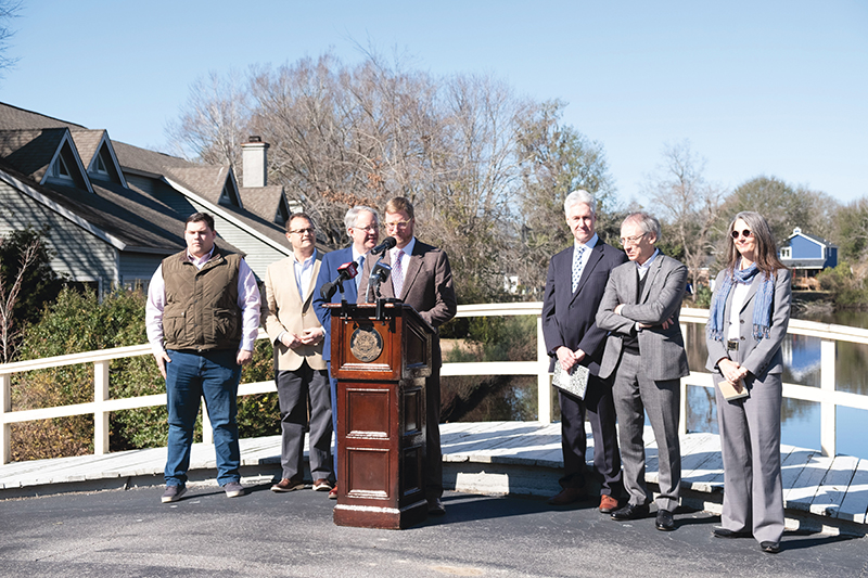 In January 2019, a press conference to introduce Dutch Dialogues was held in West Ashley, at an area of repeated flooding in the Church Creek basin. Mayor John Tecklenburg (third from left) asserted his commitment to solving flooding problems. To his left: Winslow Hastie, CEO of Historic Charleston Foundation, as well as Dutch Dialogues consultants Dale Morris, David Waggonner, and Janice Barnes.  Photograph by Sarah Alsati