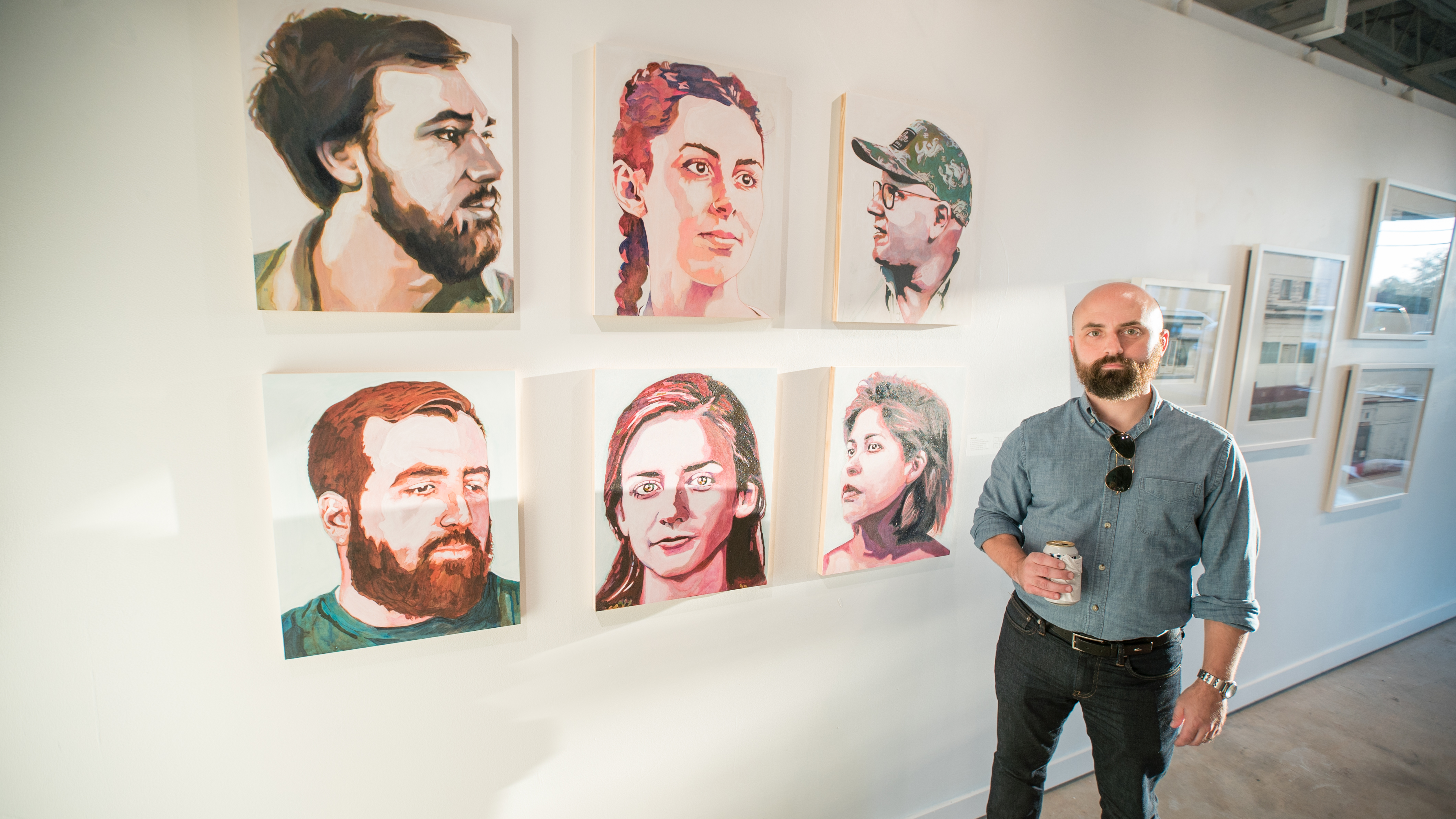 Greg Hart with his portrait series of Charleston-area creatives