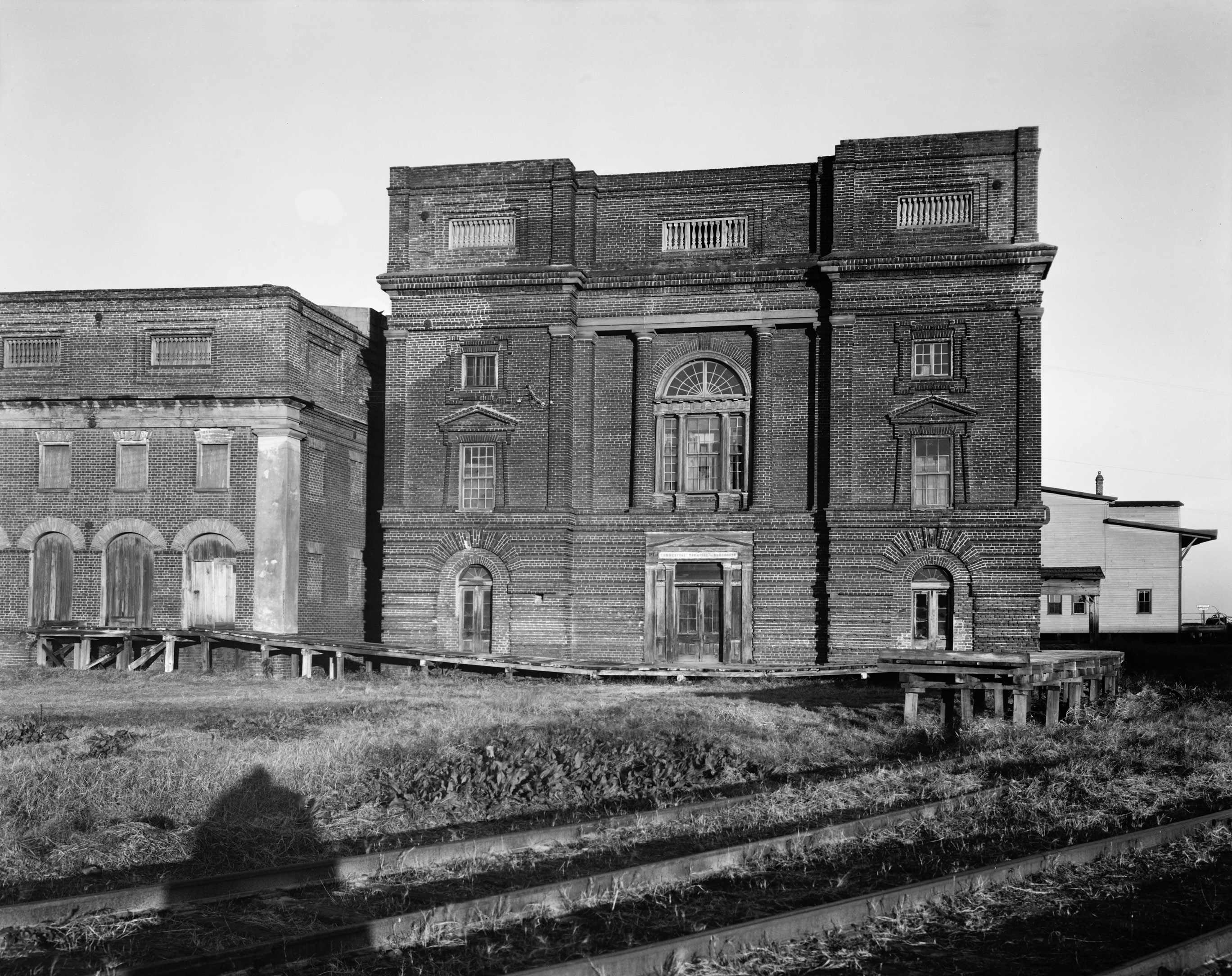 Bennett’s wealth allowed him to create a building for milling rice that was both utilitarian and a masterpiece blending Classical Revival and Italian Renaissance styles. Bennett Rice Mill, circa 1937,  by Frances Benjamin Johnston