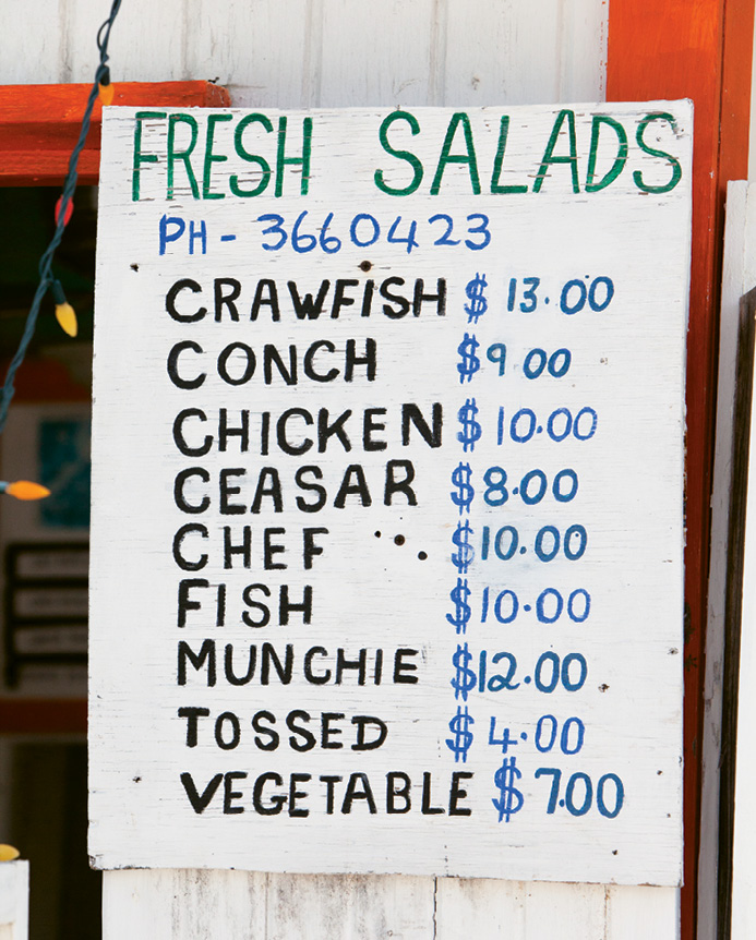 The menu board at a roadside lunch shack in Hope Town