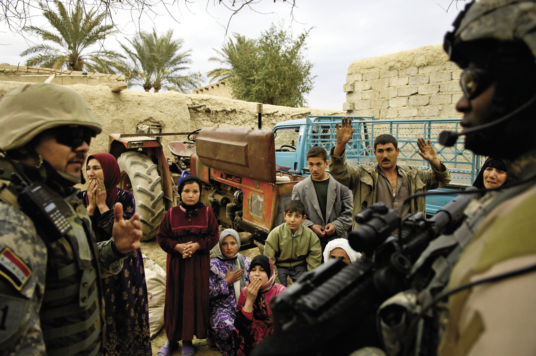 February 10, 2007: While searching for al-Qaeda and Ansar al-Sunna forces during Operation Orange Justice in Buhriz, Iraq, members of the Multi-Iraqi Transitional Team, 4th Battalion, 2nd Brigade, 5th Division question the locals.