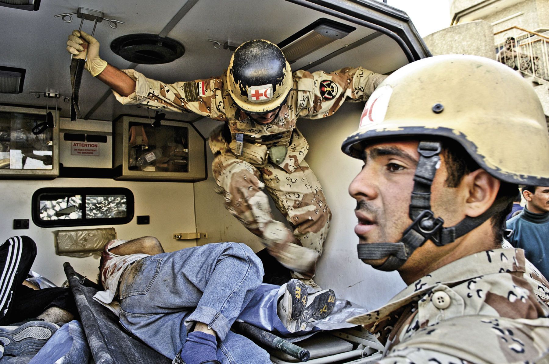 March 29, 2007: Iraqi Army soldiers load the bodies of deceased enemy forces into a waiting ambulance in Baqubah, Iraq.