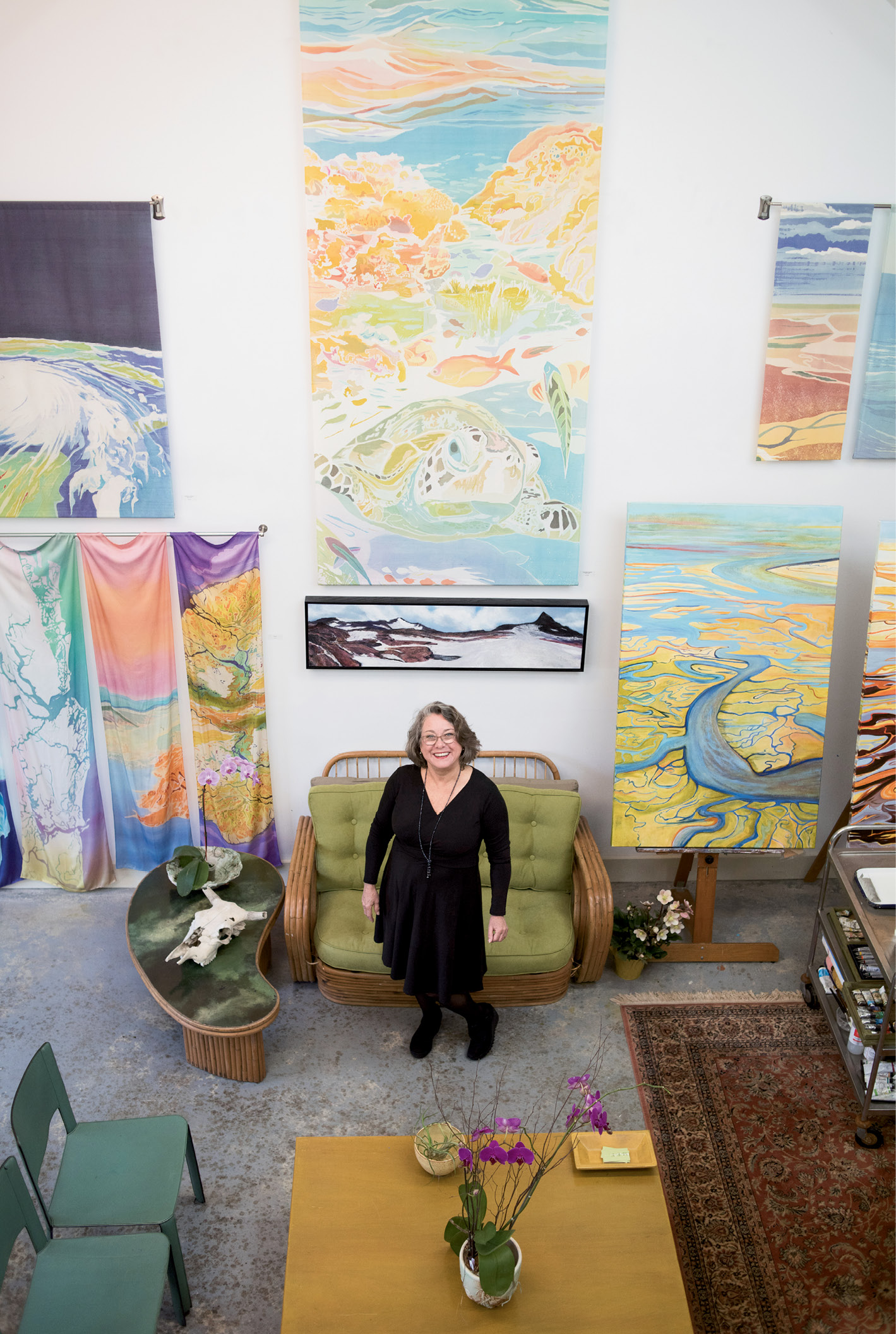 Looking Up: Fraser (photographed in her studio) brings an aerial perspective to her works, giving viewers a broader understanding of how human actions impact the landscape. “I go where I feel I’m most needed,” she says, in choosing her subject matter.