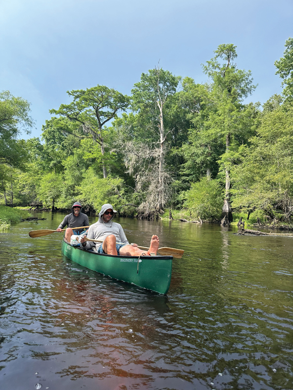 Ryland kicks back in a canoe built for two.