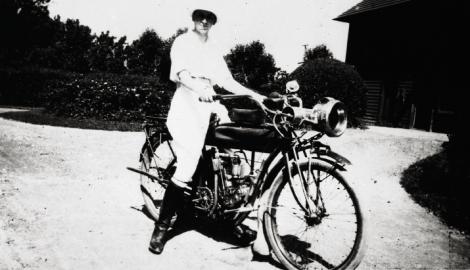 Belle rides a motorcycle at the family’s rented summer estate in 1915