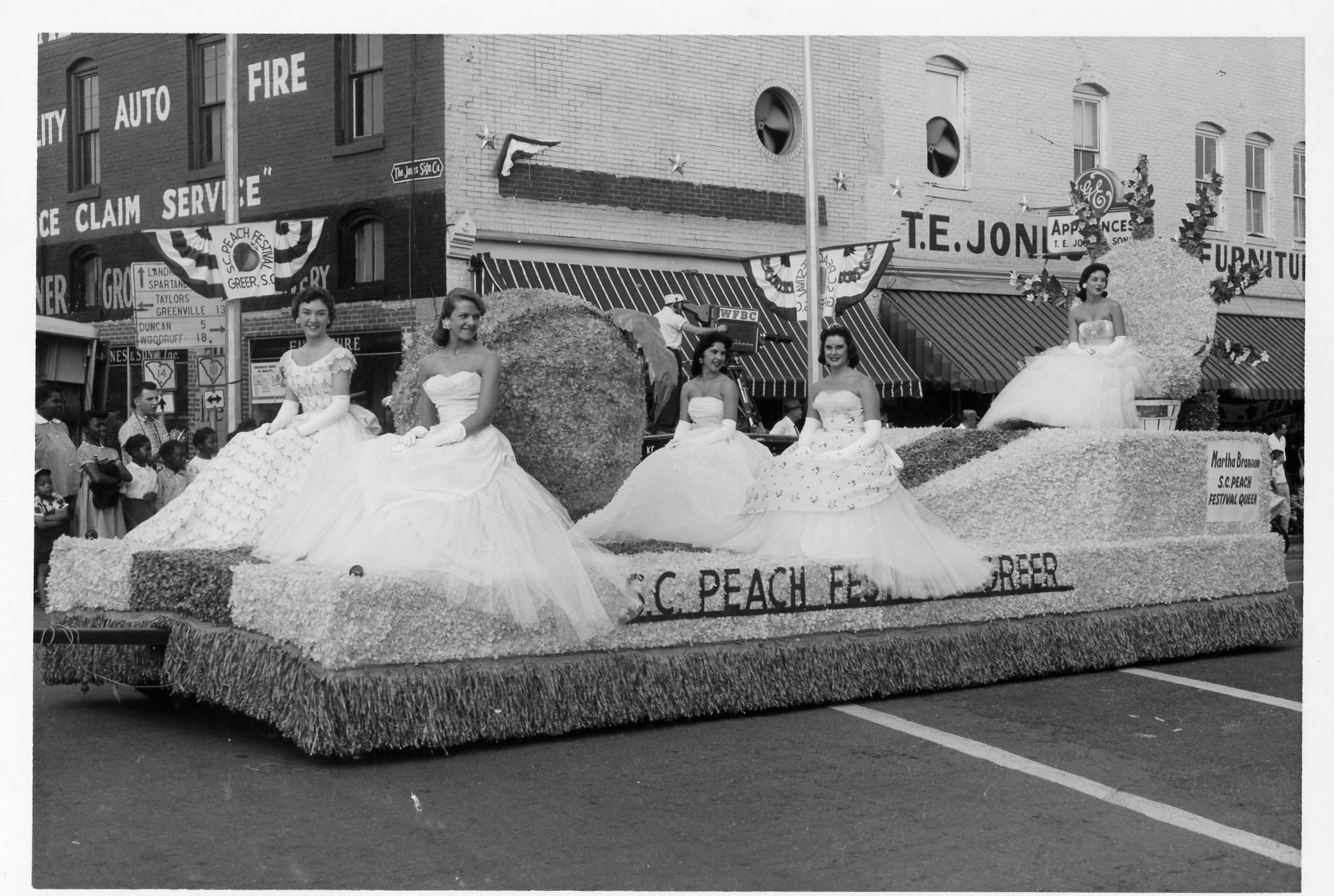he 1958 Greer Peach Festival parade and float featuring the previous year’s Peach Queen Martha Brannon.