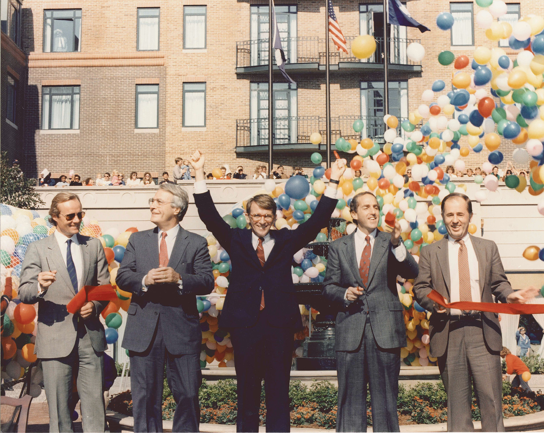 Then-Mayor Joseph Riley Jr. (left center) celebrates the opening of Charleston Place on September 2, 1986.