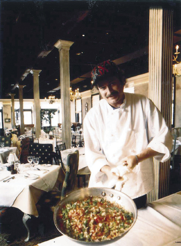 The chef with the beginning of a okra and shrimp creole in the SNOB dining room circa 1998
