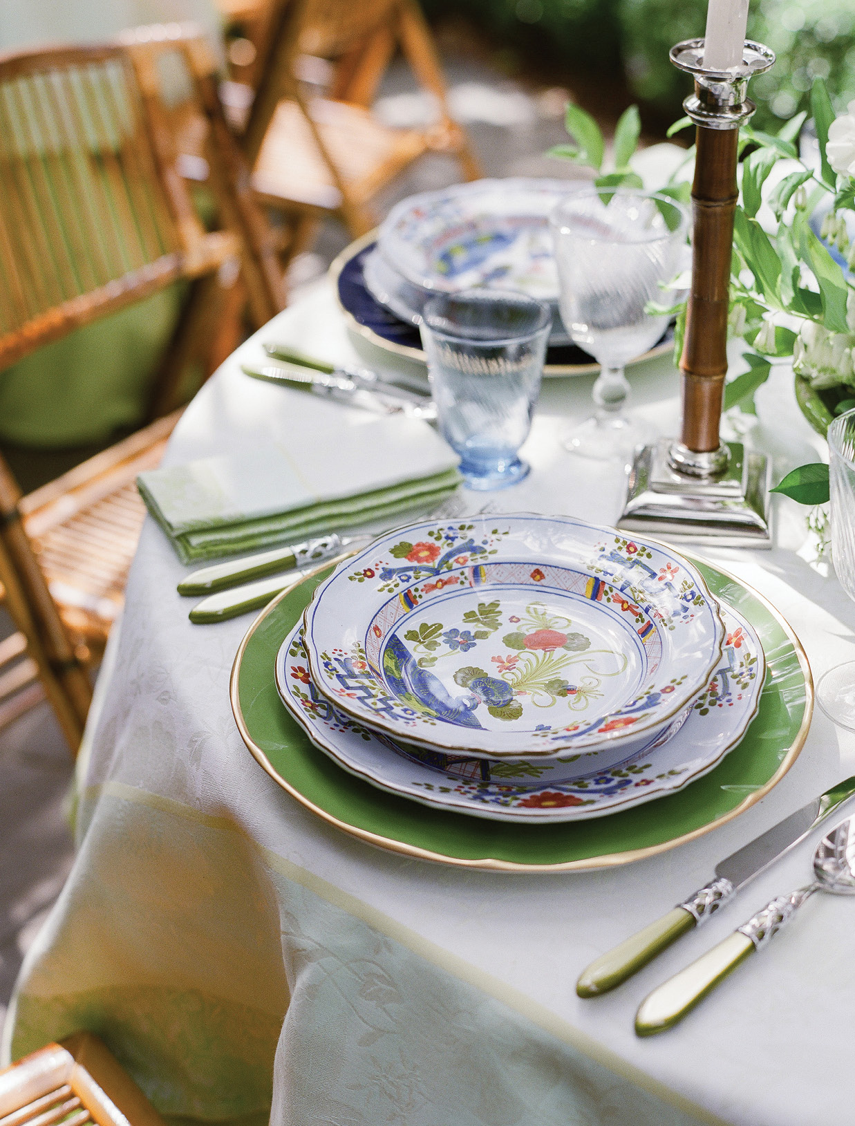 Each place setting pairs the Italian plates and bowls she and Dean selected when they were first married with bright chargers and Vietri utensils. “We have beautiful family silver that we use for more traditional dinners,” says Lynn, “but the colorful cutlery just says, ‘Fun!’’