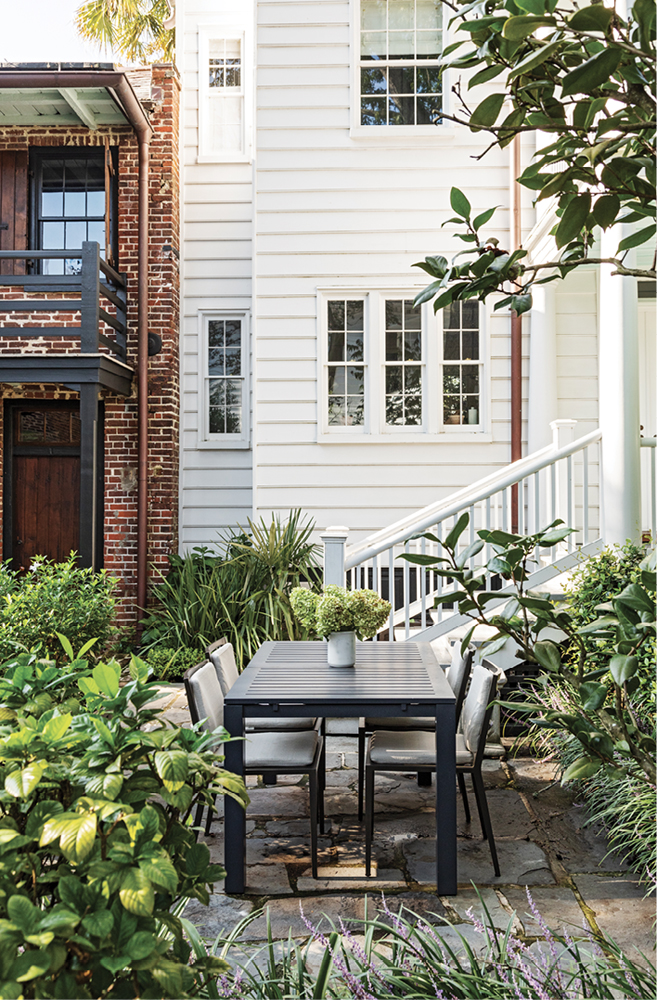 Today, one “room” holds a delightful outdoor dining area atop a bluestone patio, where JANUS et Cie outdoor chairs provide a place to sit, eat, and soak up the history.