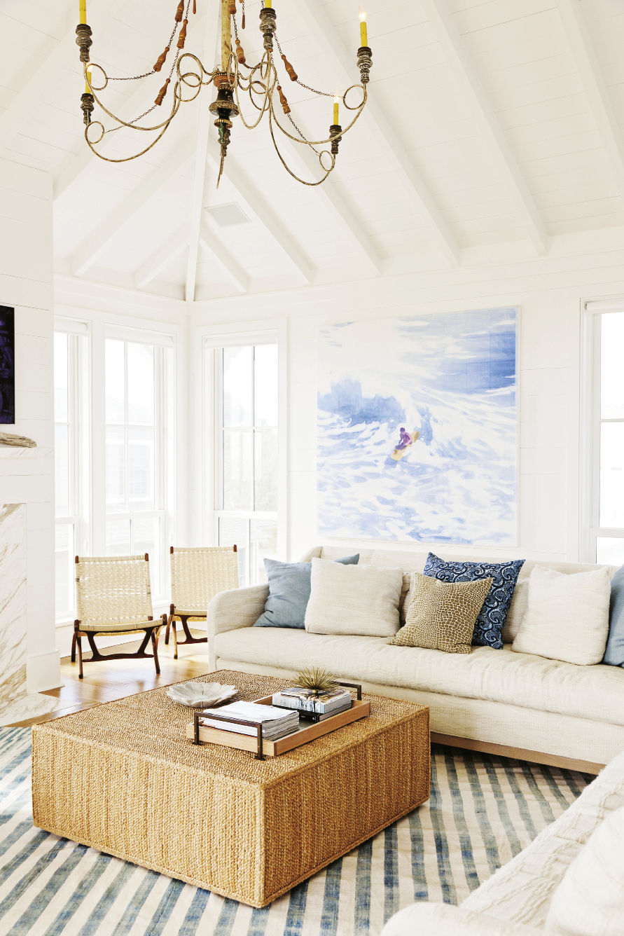 The Big Picture: The soothing vista of an endless horizon makes a breathtaking backdrop for this Sullivan’s retreat. White shiplap walls give a classic old beach-house feel while showcasing primo contemporary art, like this surfer painting by Isca Greenfield Sanders.