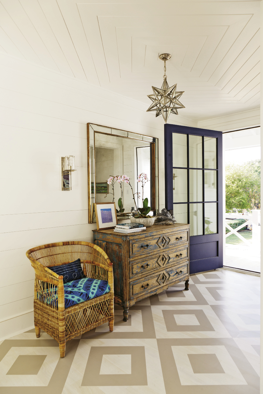 Surfs Up: A painted foyer floor helps “gives an unexpected punch, leading upstairs,” says Keenan.