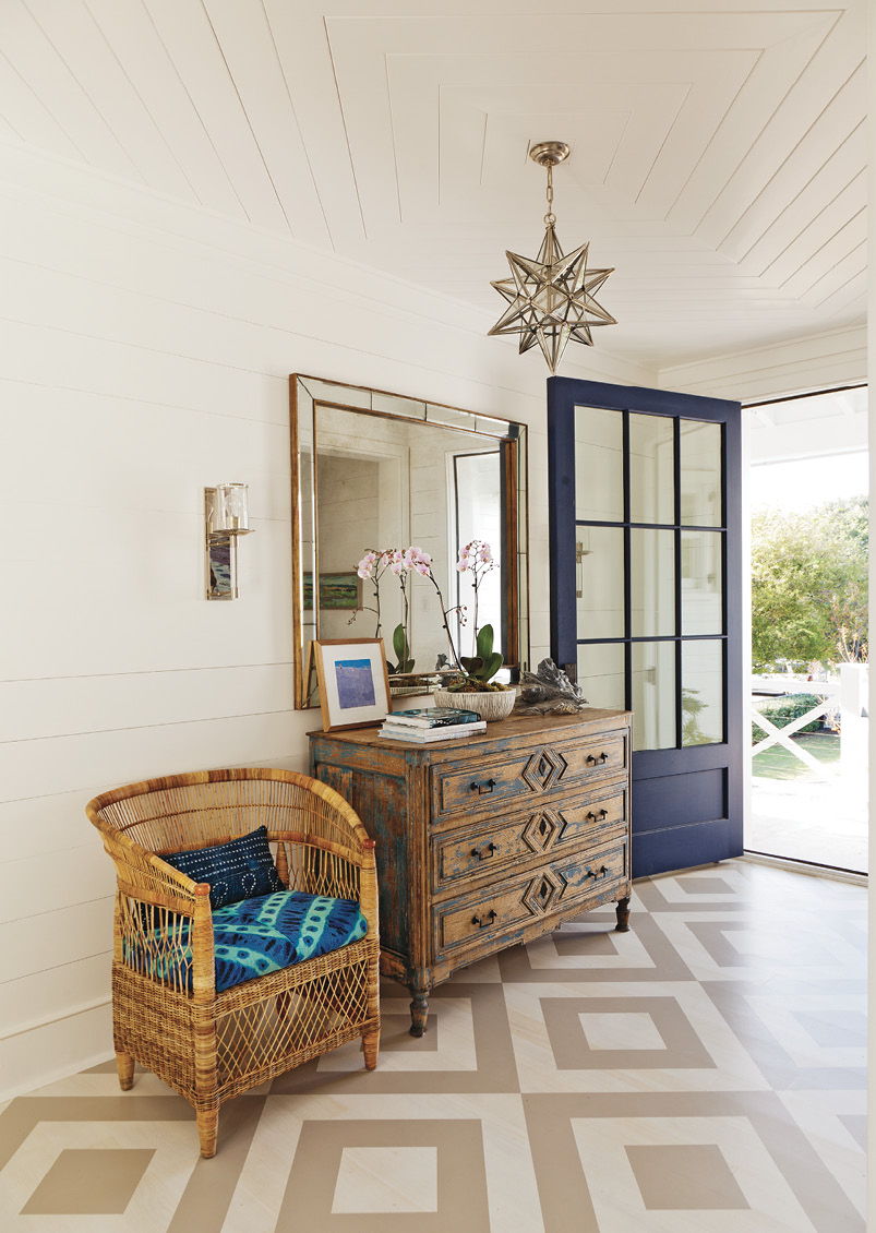 Pattern Play: The foyer’s painted floor “gives an unexpected punch,” says designer Jenny Keenan. It sets the tone for the beautiful yet casual and comfortable interiors the homeowners wanted.