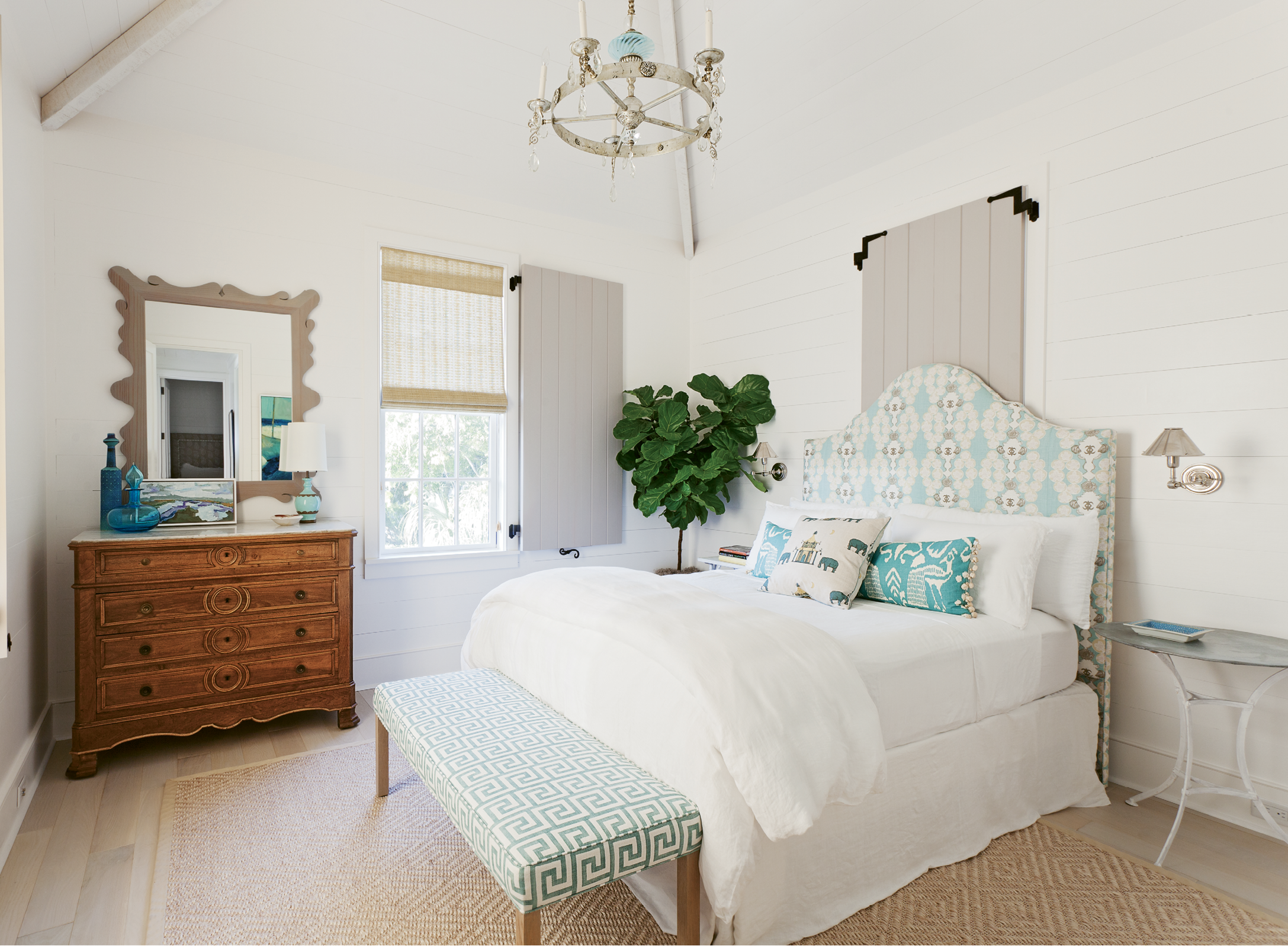 A guest bedroom, outfitted with dreamy creams and blues, proves that comfort and style can come in smaller sizes.