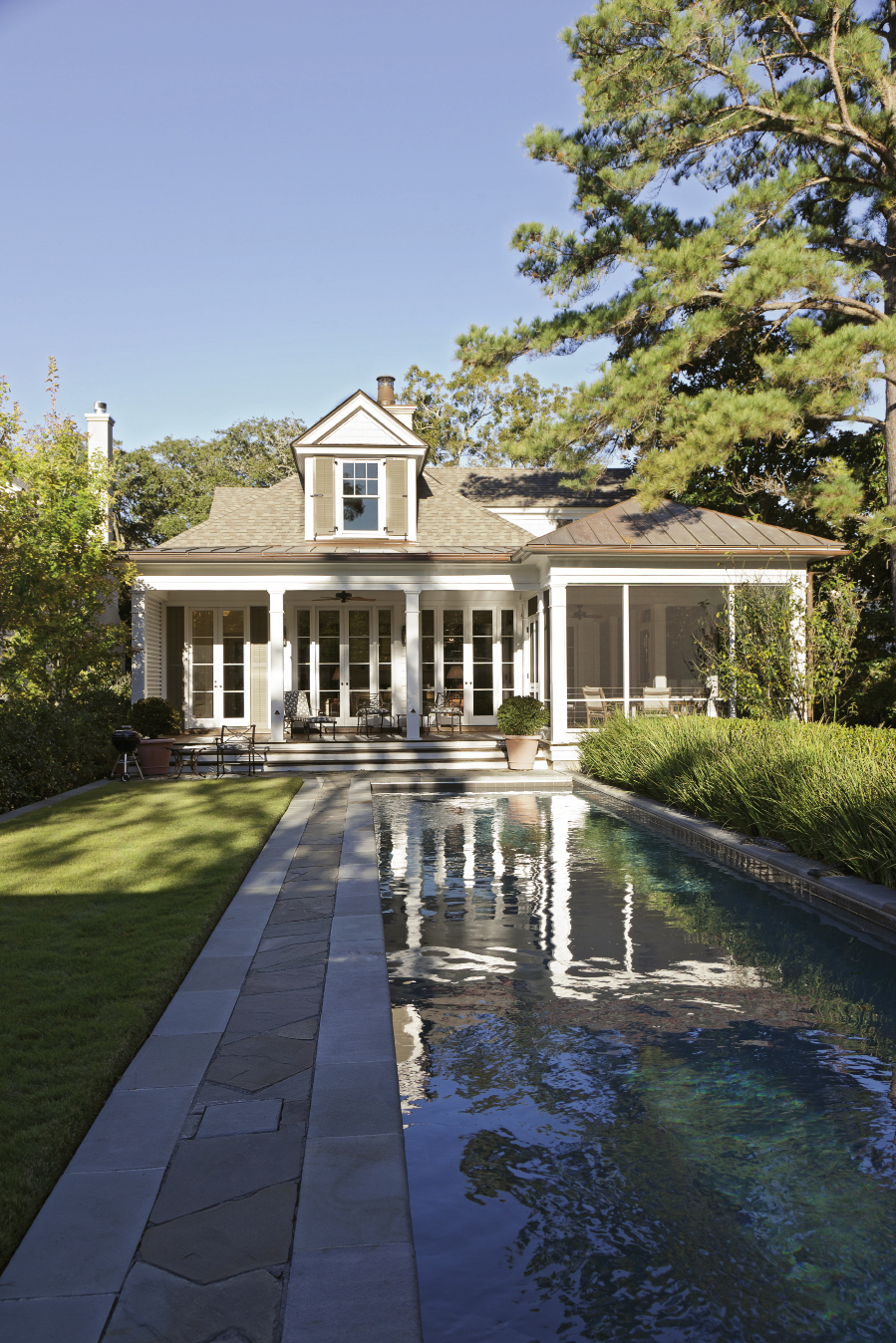 The lawn and pool area are seamless extensions of the house, which was designed by Dufford Young Architects.