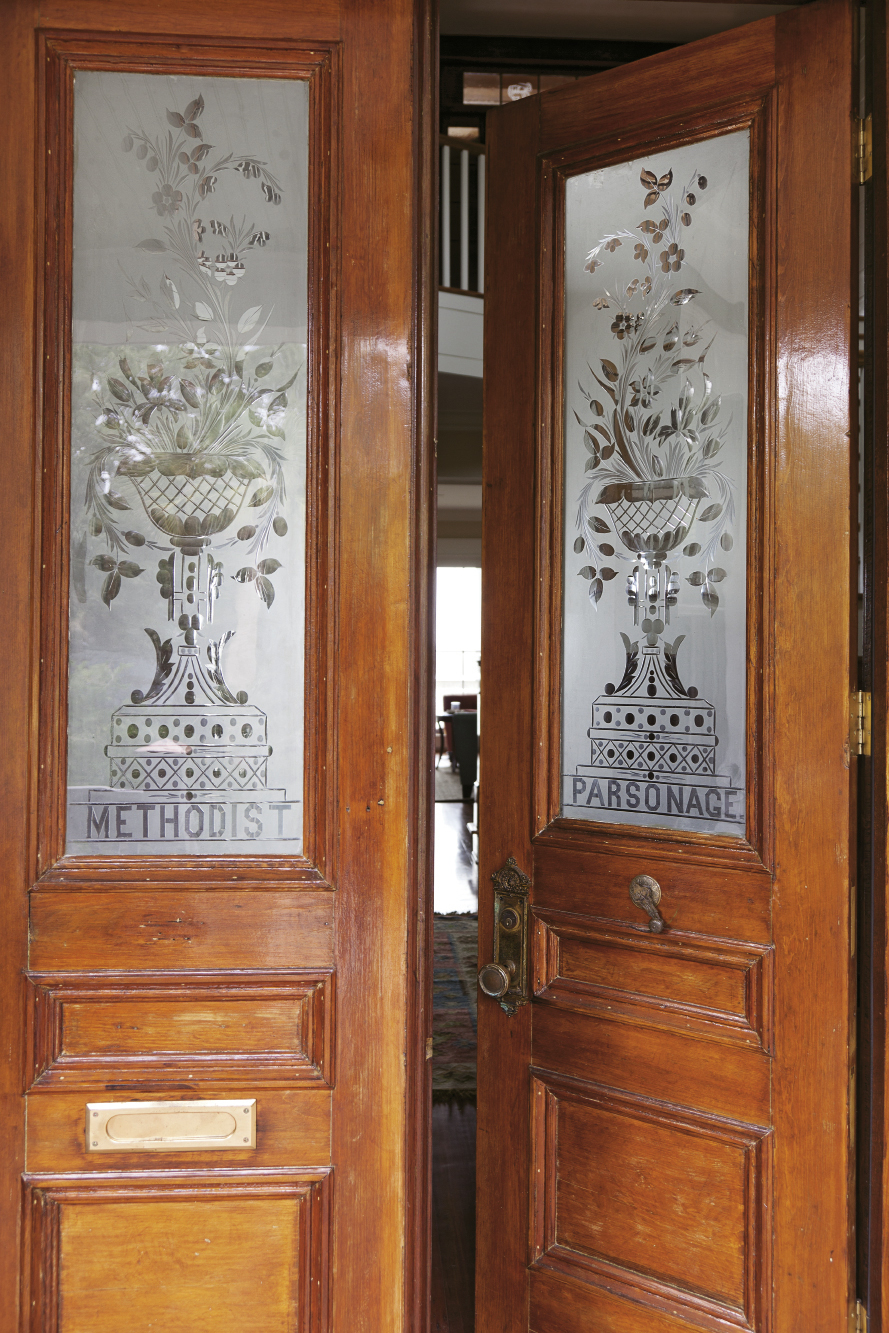 Salvaged doors from a Methodist parsonage were installed as front doors
