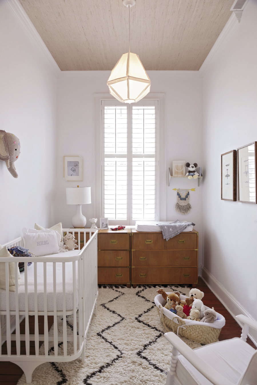Baby Hugh’s nursery (above, right) features a mid-century dresser, handsome grass-cloth ceiling, and vintage airplane prints.