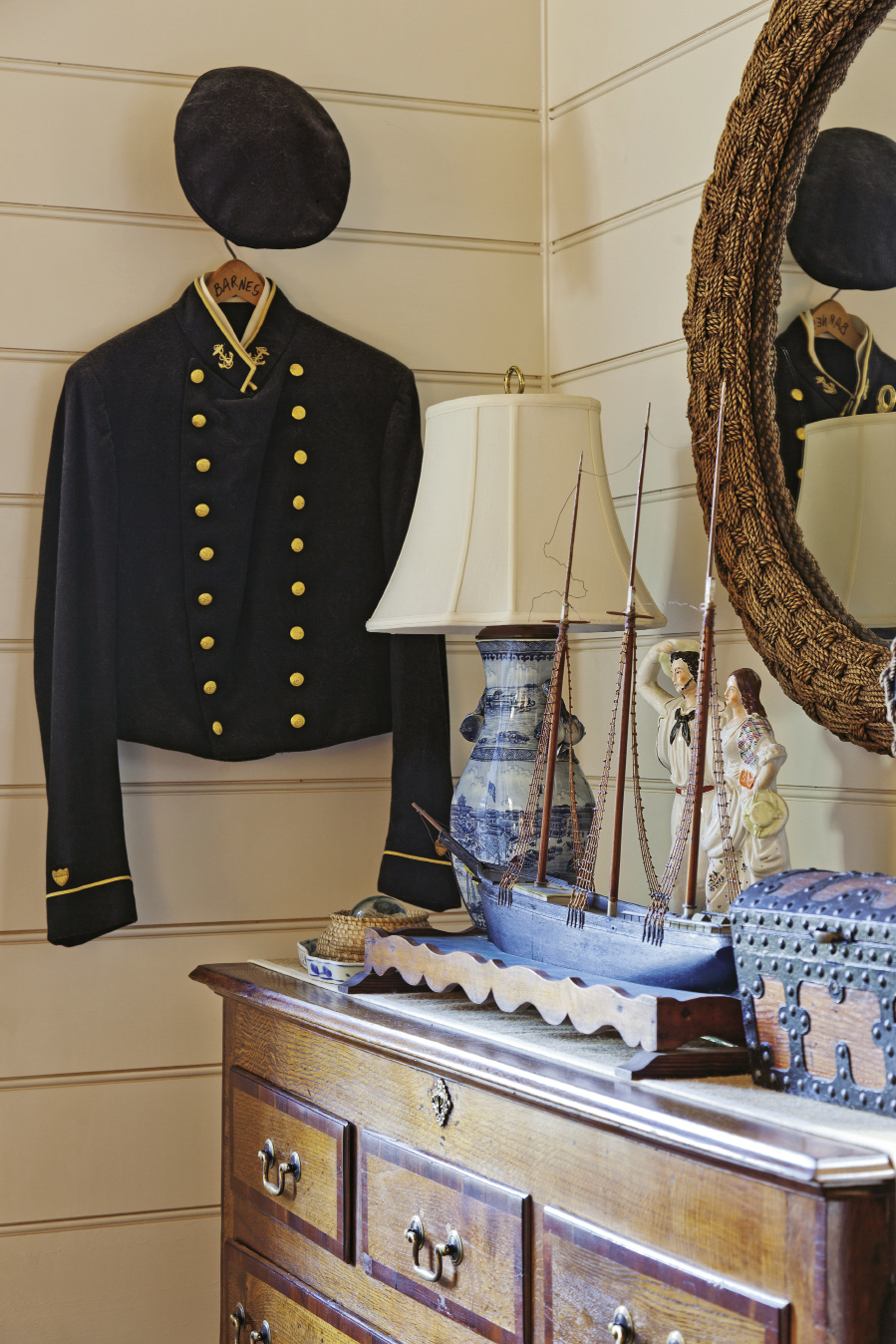 An antique seafarer’s uniform graces the second-floor bedroom.