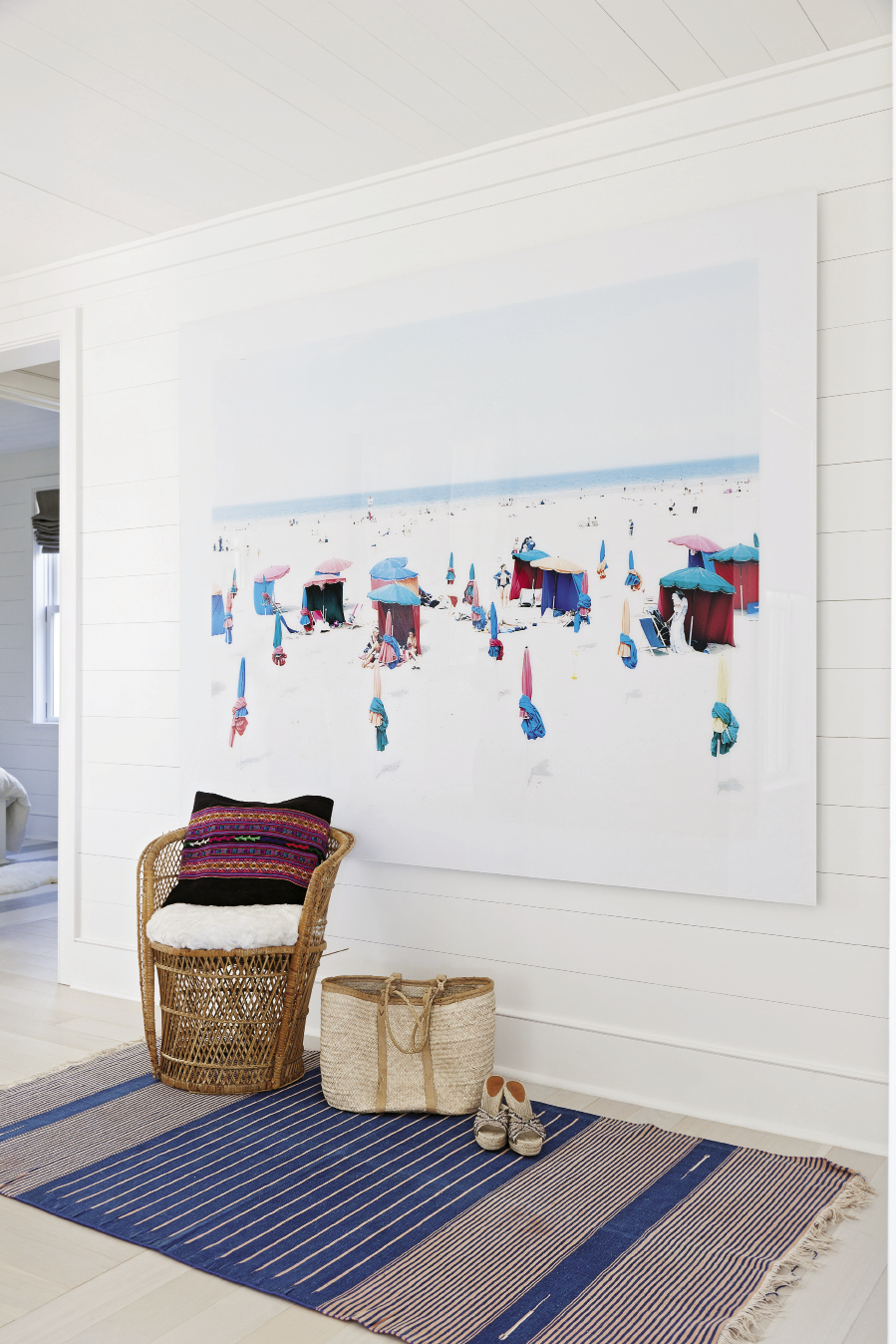 A wall-size panorama by Italian photographer Massimo Vitali makes for captivating beach viewing inside and out.