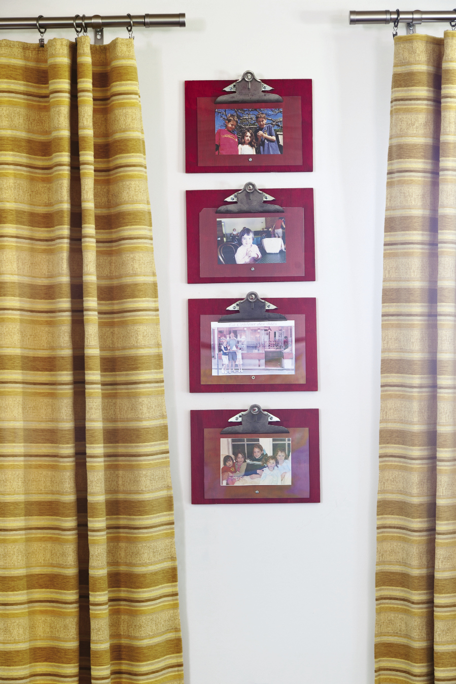 Mathis crafted these frames from plywood, plexiglass, and binder clips. Hung in a group, they elevate family photos into works of art.
