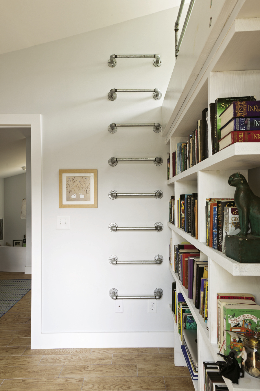 Wall-mounted ladders made of galvanized pipe are also space efficient.