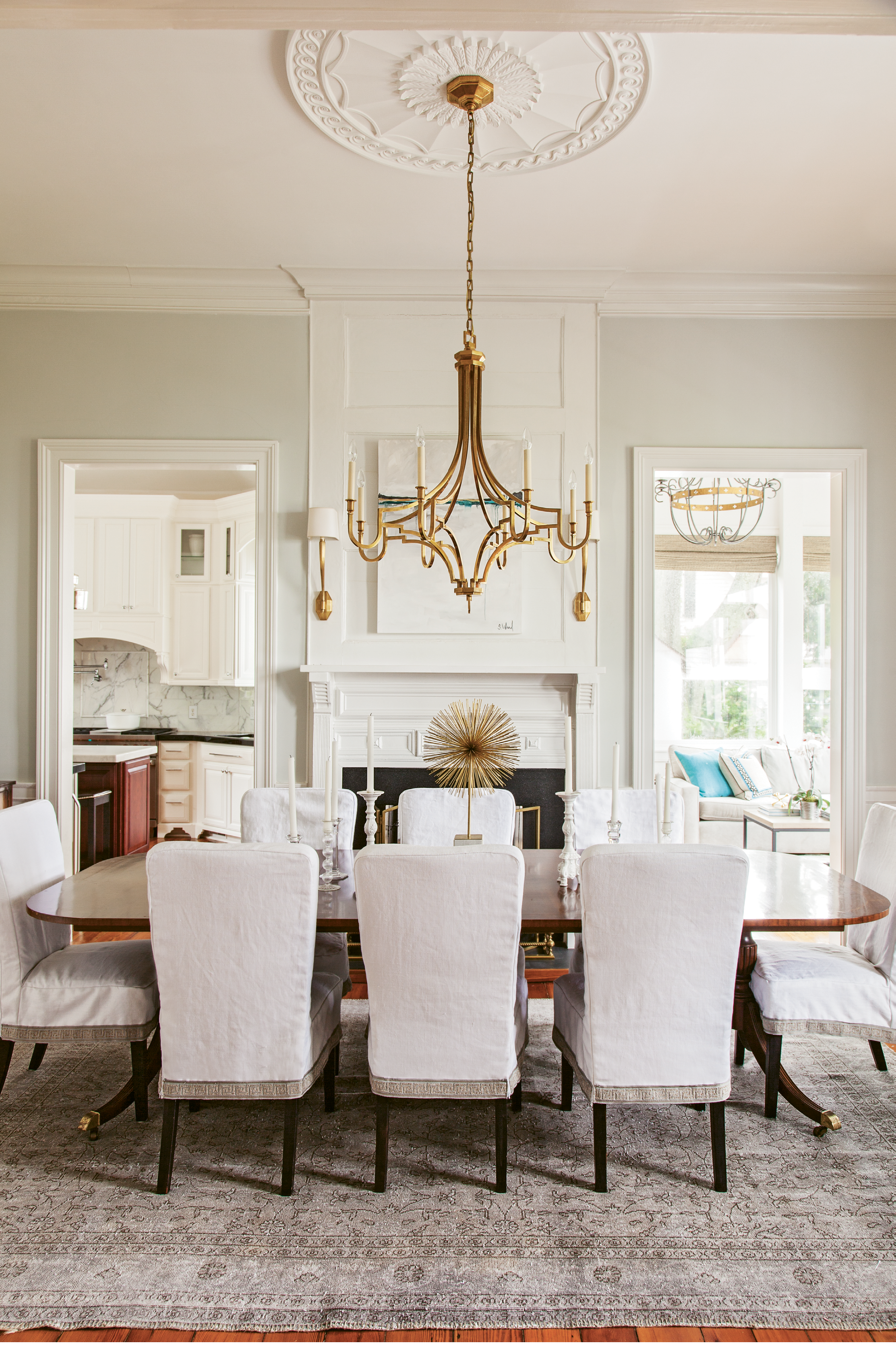 With the help of interior designer Amee Leland, the homeowners replaced numerous heavy and dated crystal chandeliers with sculptural modern selections more suited to the couple’s casually sophisticated aesthetic.