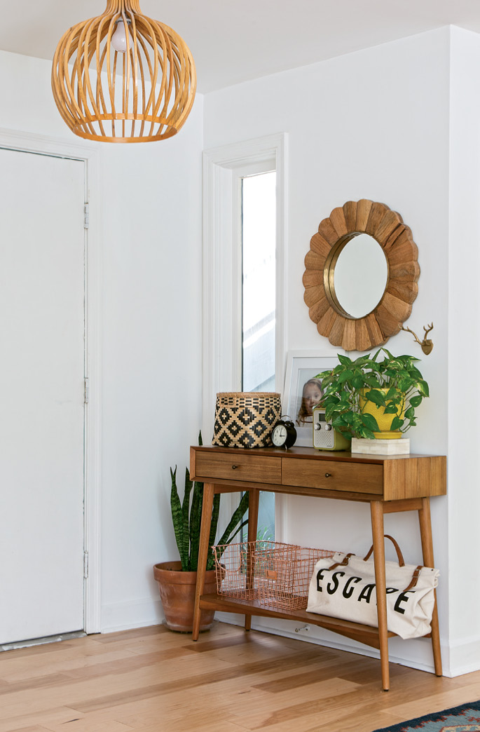 A mid-century-inspired console from West Elm anchors the foyer.