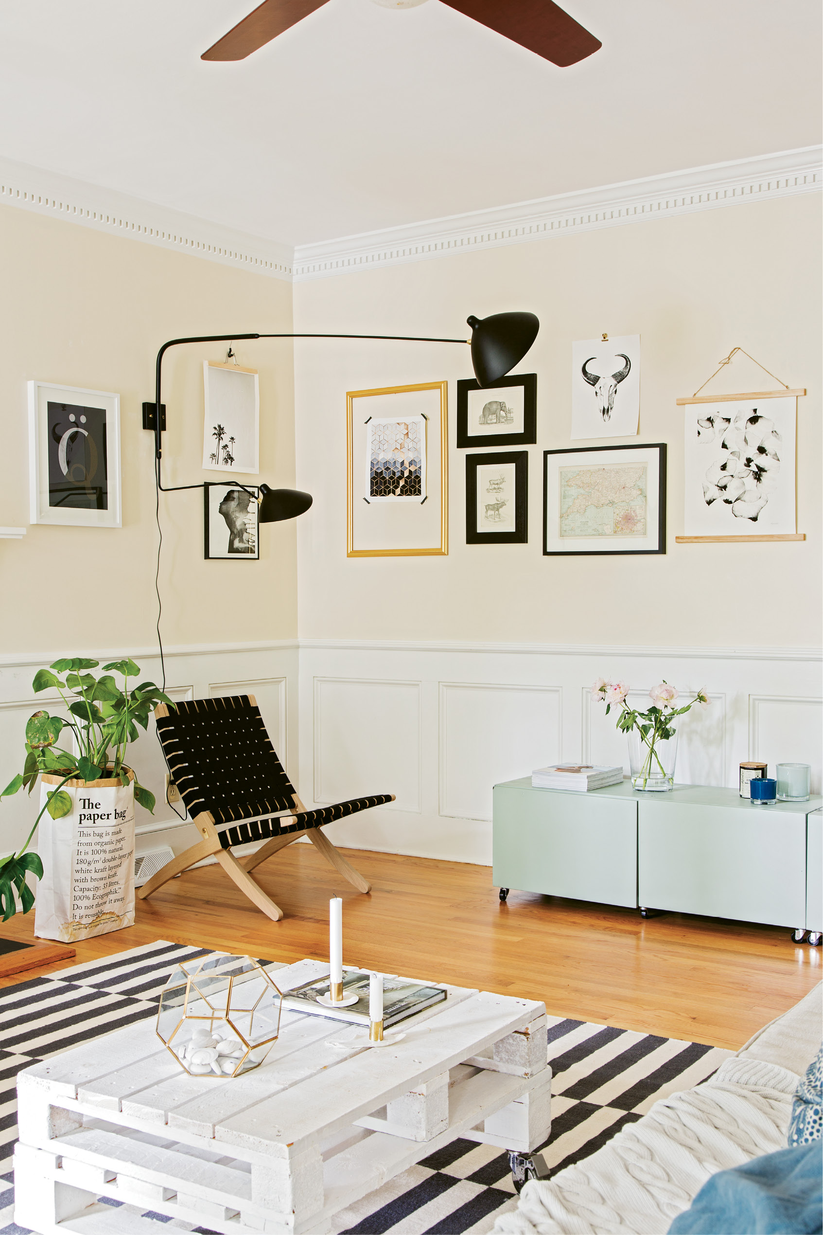 NATIVE STYLE: Therese filled the living room with natural materials, pastel and monochrome color schemes, and lots of plants—all hallmarks of the Swedish design aesthetic. (Opposite top) Gallery walls are found throughout the house; a black-and-white palette connects them all, making the spaces feel cohesive.