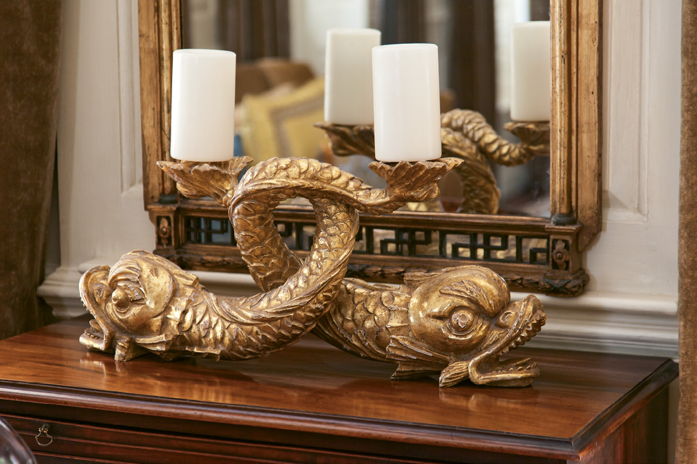 18th-century gilt dolphins found through G. Sergeant Antiques play nicely off the gold tones seen throughout.