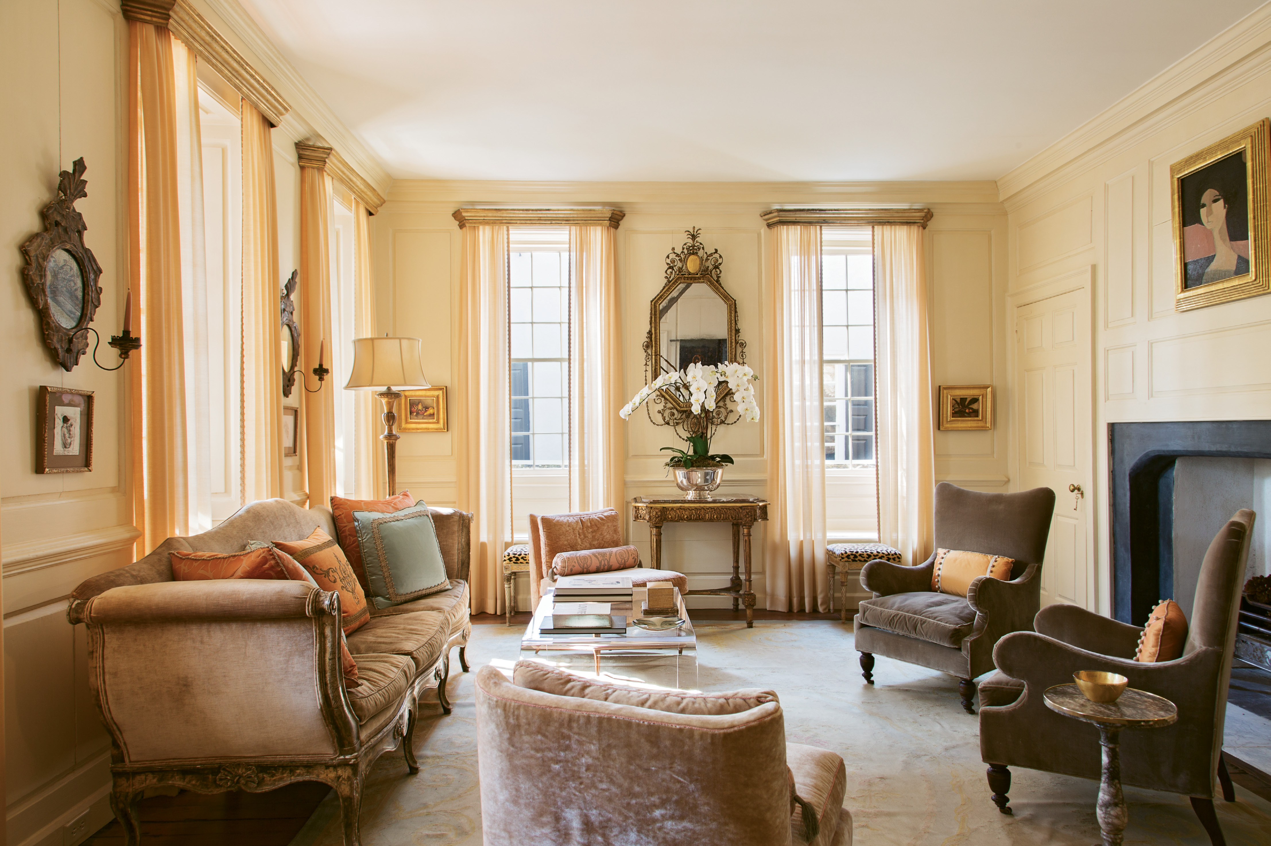A 1968 portrait by French painter André Minaux sets the tone for the first-floor drawing room. “She has that little bit of pink,” says Ann. “We put her right over the classical Georgian fireplace and suddenly the room got very feminine.” Sketches by Ben Long and two still lifes by Jill Hooper round out the room’s luxe vibe.