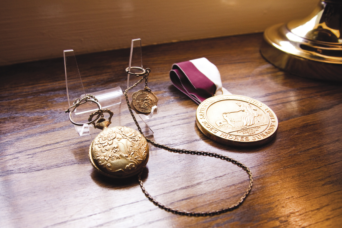 a gold pocket watch, the Bingham Oratorical Medal, and the CofC Founders’ Medal (the highest honor given by the institution), which was awarded to him in 1992. Photograph by Caroline Tan