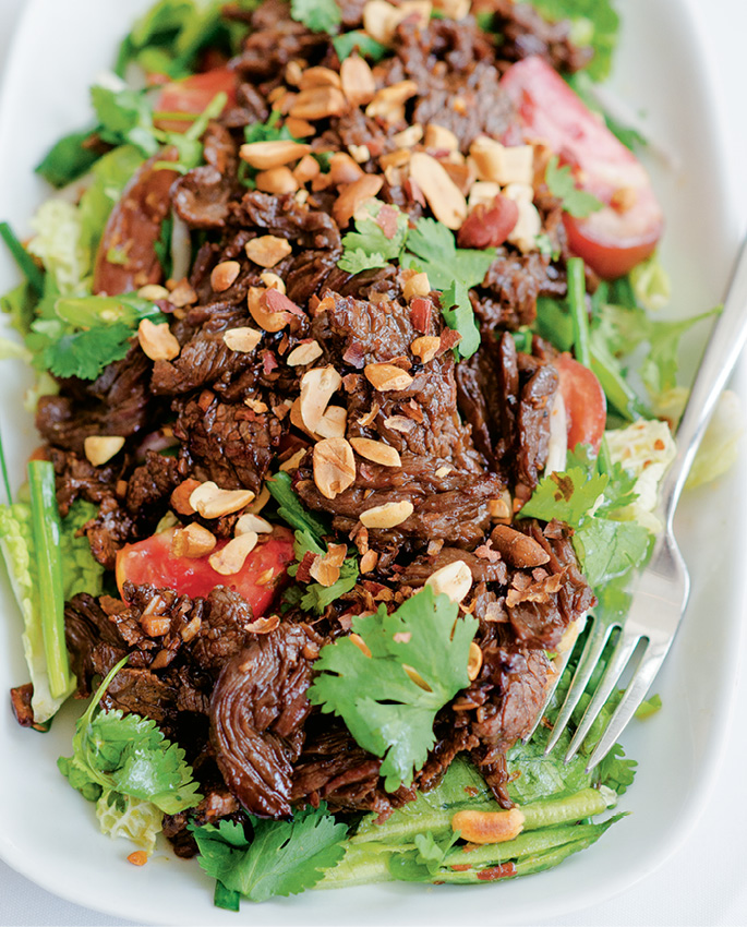 Cook’s wok-seared garlic steak with Thai salad