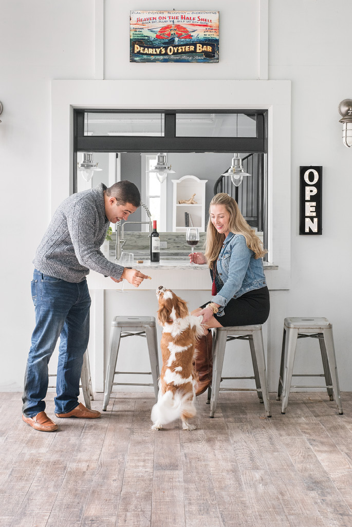 Fun for All: When they’re not swimming—the water’s a cozy 85 degrees—Valmar, Melissa, and their pup, Mason, can often be found relaxing in the outdoor living space, complete with a bar.