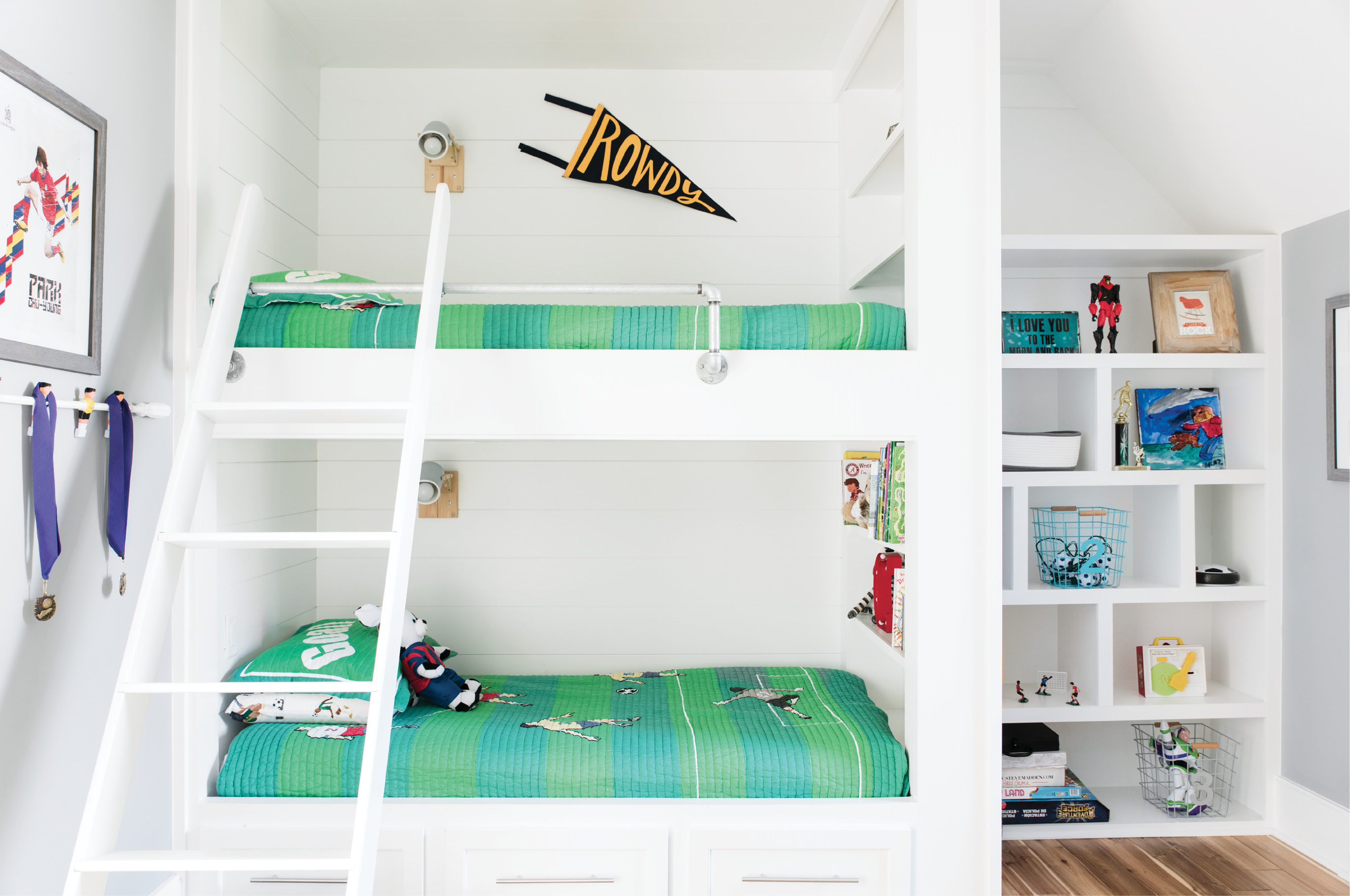 Bunk House: In eight-year-old Cruz’s room, soccer-themed bedding from Wayfairer.com adds a kid-friendly dose of color to shiplap bunk beds. A few lengths of pipe and fittings make for a stylish rail on the top bunk.