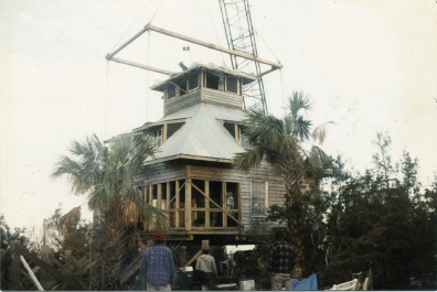 As Don Thompson’s home on Goat Island was set back onto its foundation, the telephone rang.