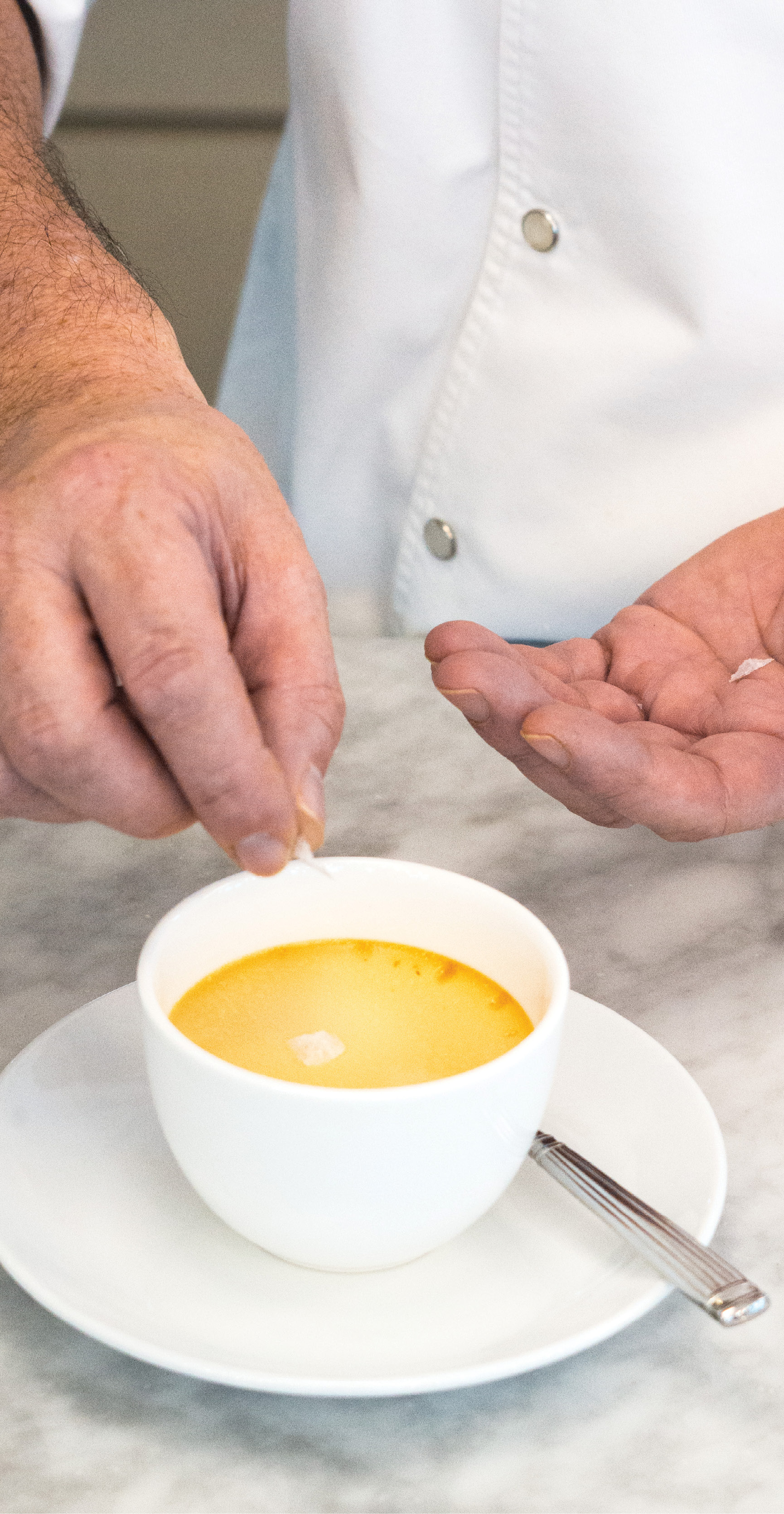 Finishing Touch: Chef Fünfrock uses Maldon flake salt to garnish his pot de crèmes.