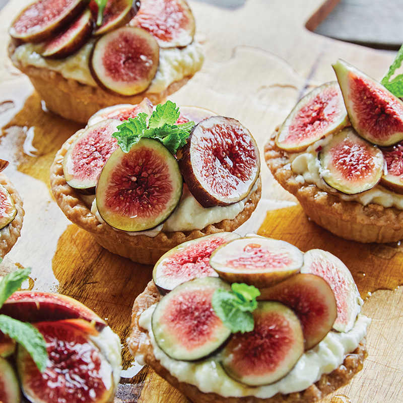 Hot honey and cool mint play against sweetened mascarpone in this rustic tart, which the chef tops with in-season figs, such as Celeste and black mission.