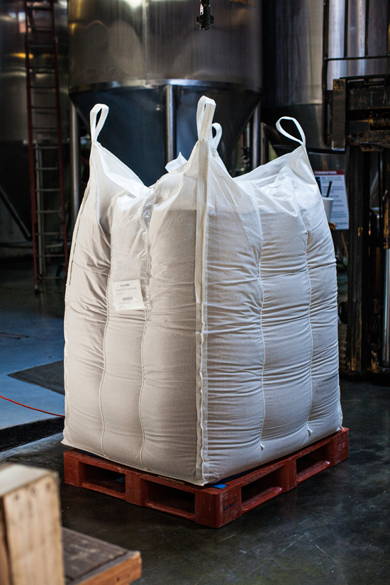 A pallet of malted barley rests waiting to be milled, and mashed