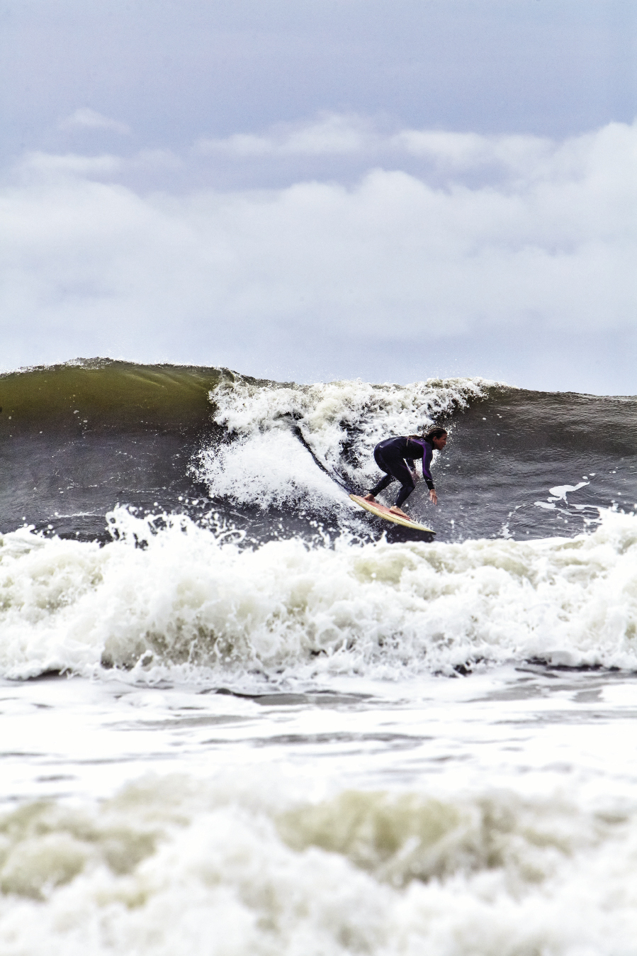 Jenny Brown takes off on an offshore peak.