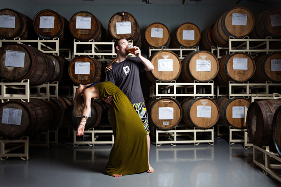 Morgan and Edward dance in the barrel aging room.