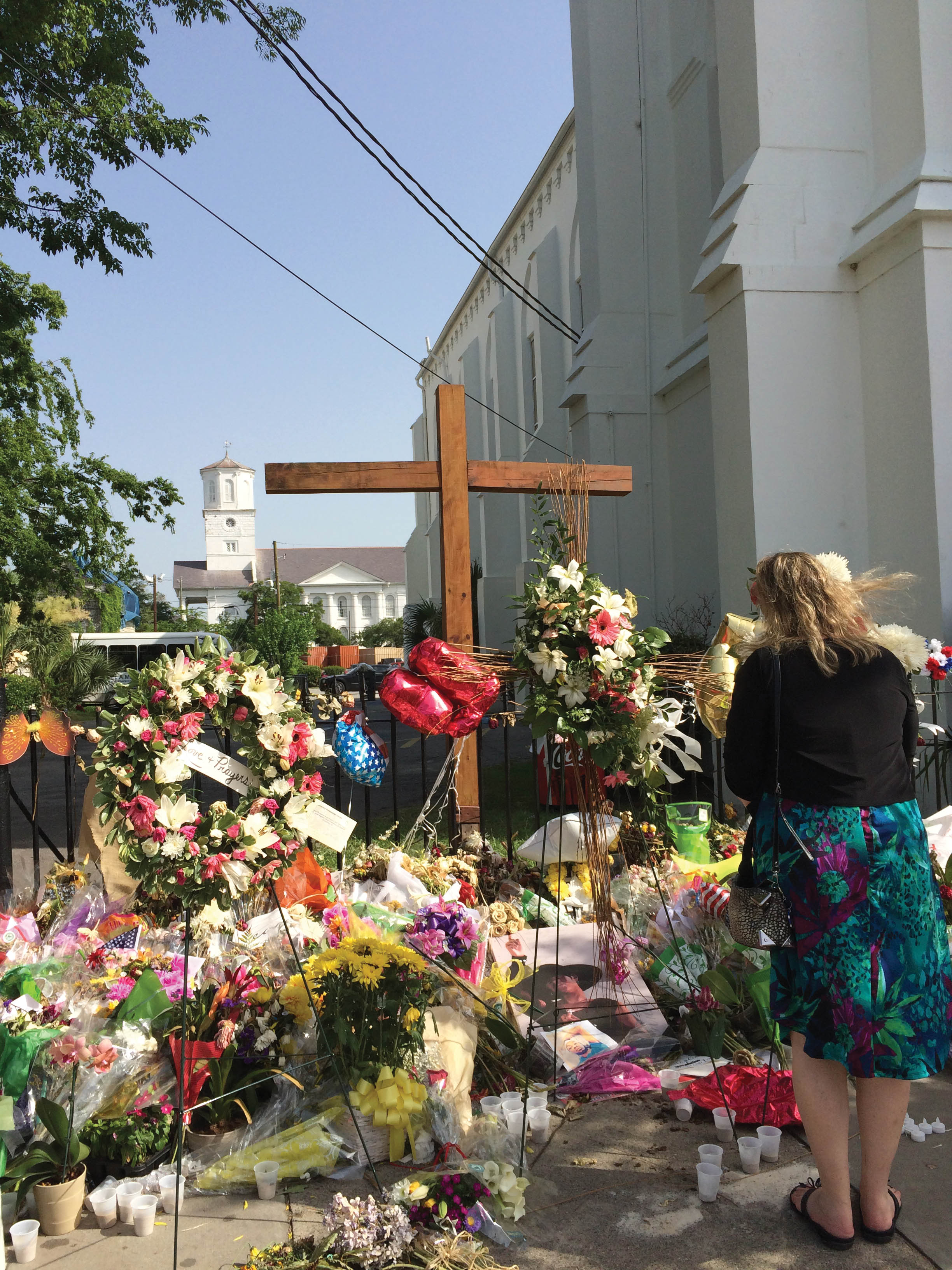 In this photograph taken on June 24, 2015, the steps of Mother Emanuel demonstrate the collective outpouring of grief for the victims, survivors, and their families in the days and weeks after the tragedy.
