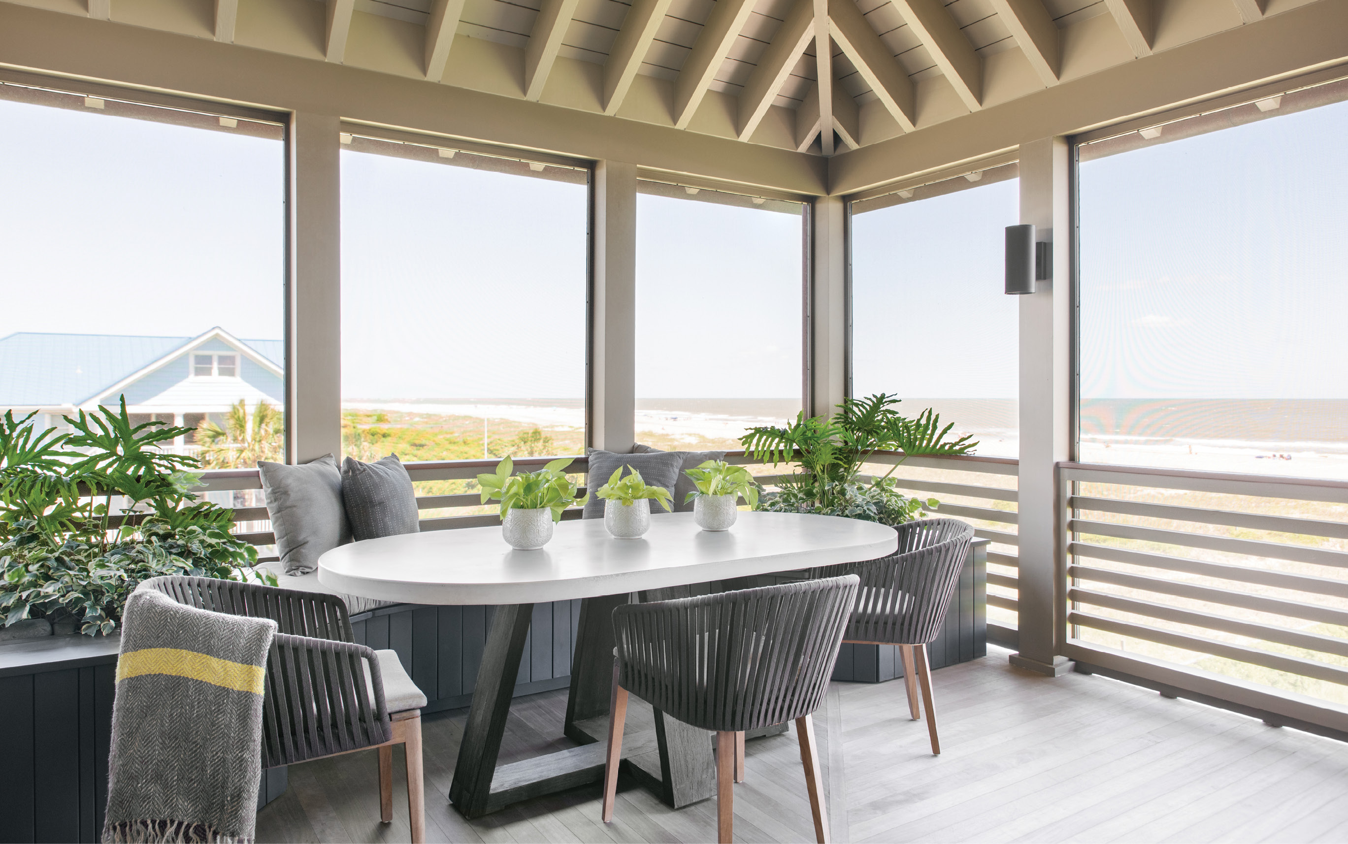 Viewfinder: With multiple porches, there’s always somewhere to sit and soak up the views. But the dining porch, complete with a custom oval concrete and elm table by Clubcu and JANUS et Cie Mood chairs, tops them all.