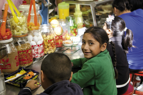 Children play into the night and treat themselves to sweets.