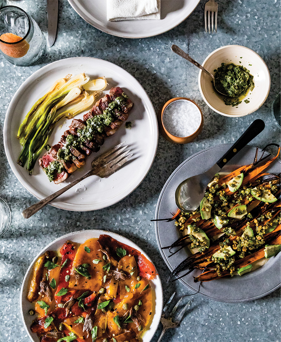 For a presentation that’s a little more rustic, Reitz mixes the herby green sauce by hand to serve with bison strip steaks (above), tears the charred peppers rather than chopping them (below), and roughly dices avocado to top roasted carrots.