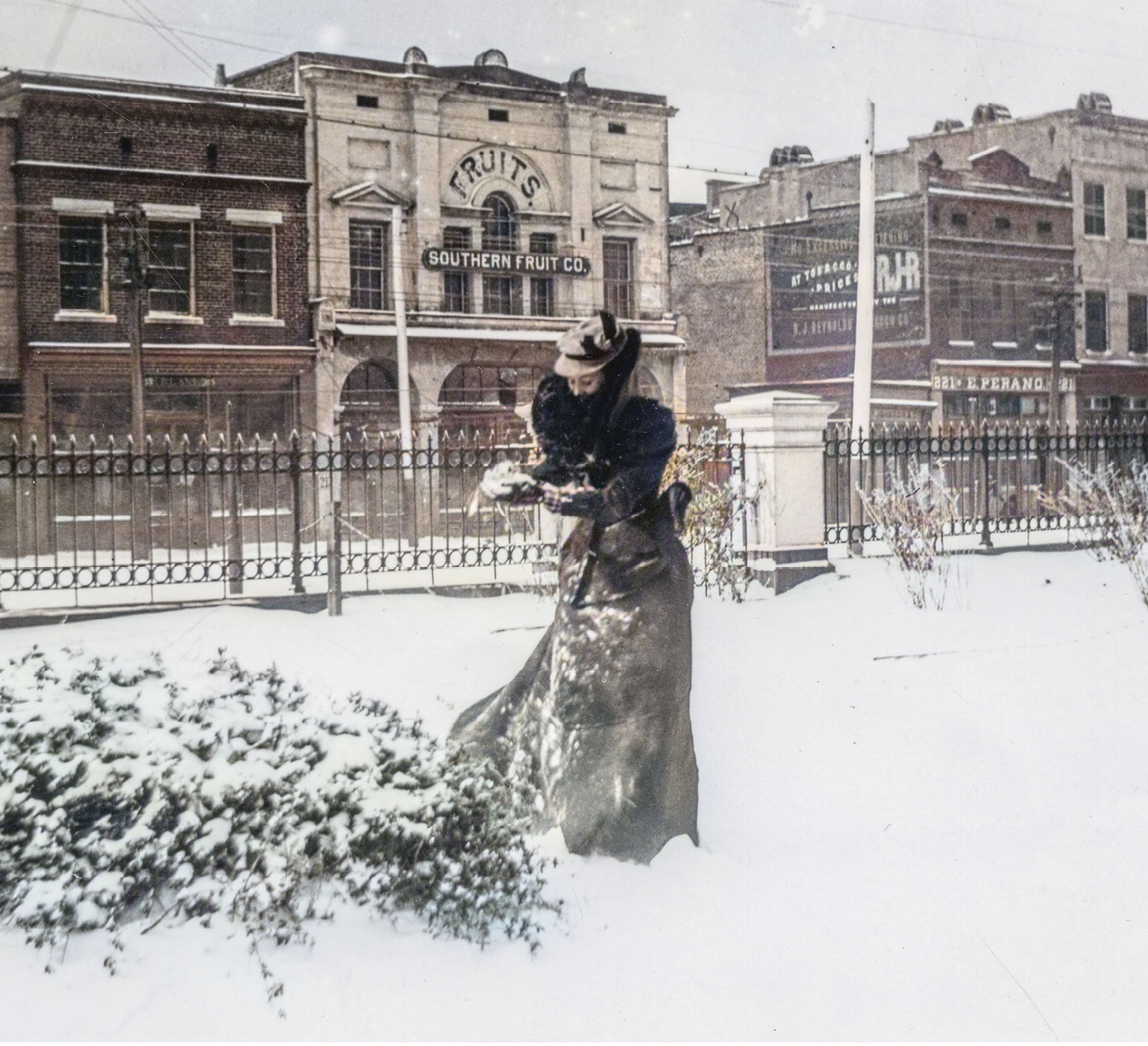 Making a Snowball, circa 1899, by Franklin Frost Sams (1867-1937)  The photographer’s wife, Elizabeth “Lizzie” Gregorie Sams, packs the powdery snow found in the yard of the Custom House on East Bay Street.