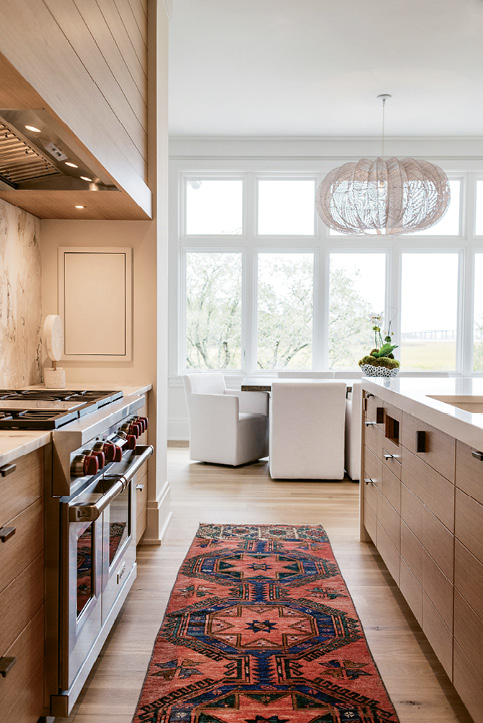 Quartz countertops and a stone-topped Restoration Hardware table make for no-sweat cooking and eating surfaces.