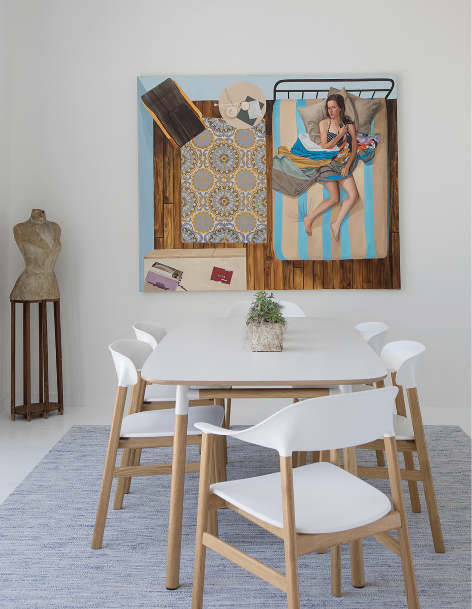SMALL TOWN CONNECTIONS: Baldwin recently hosted a dinner party around this Normann Copenhagen dining table and chairs and commented that a guest at the end of the table looked just like the young woman in the Netflix painting by Karen Ann Myers hanging above. “That’s her,” came the reply.