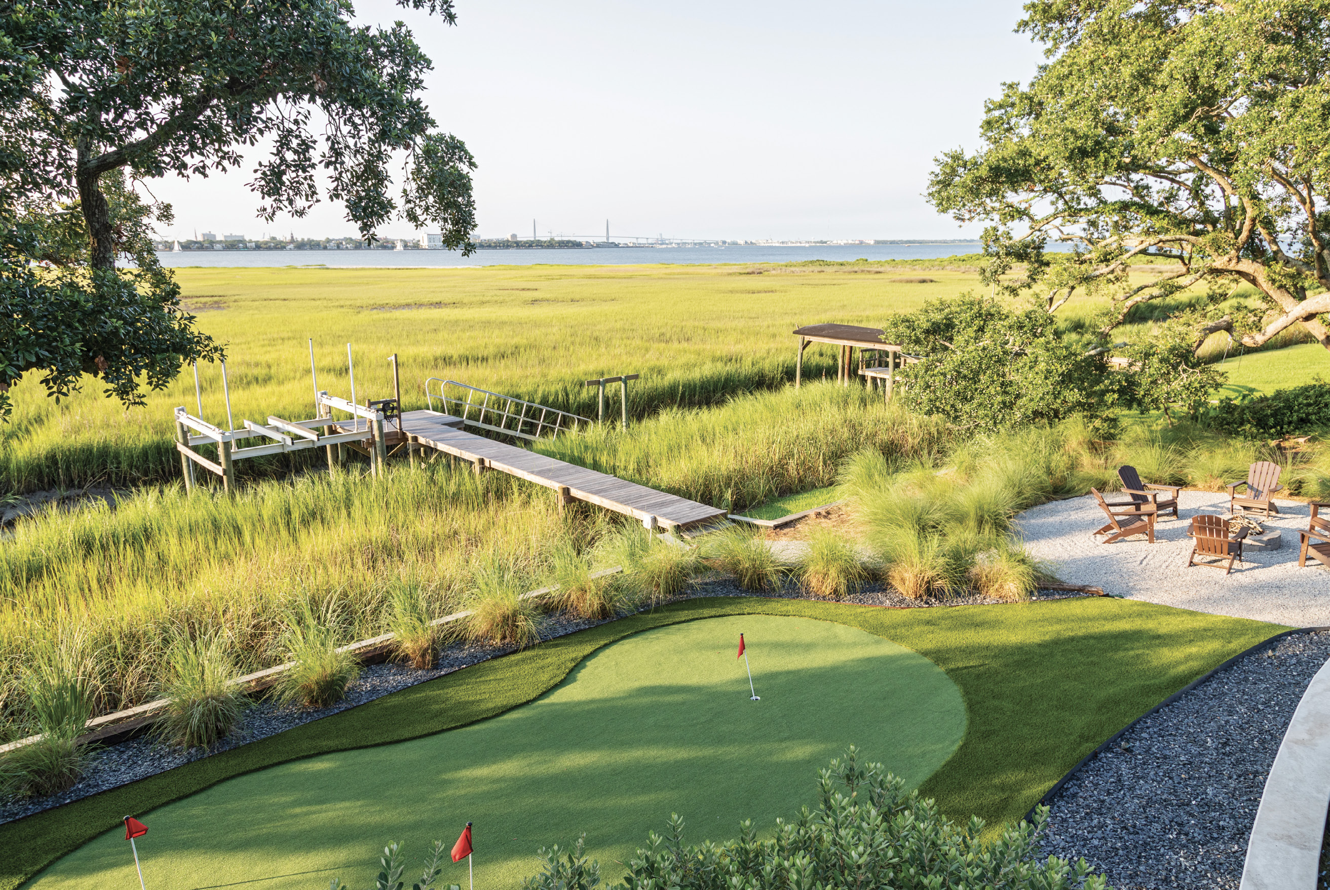 FORE FUN: Cade Miller with Graceful Gardens designed the landscape, including a putting green for Paul, a dedicated golfer.