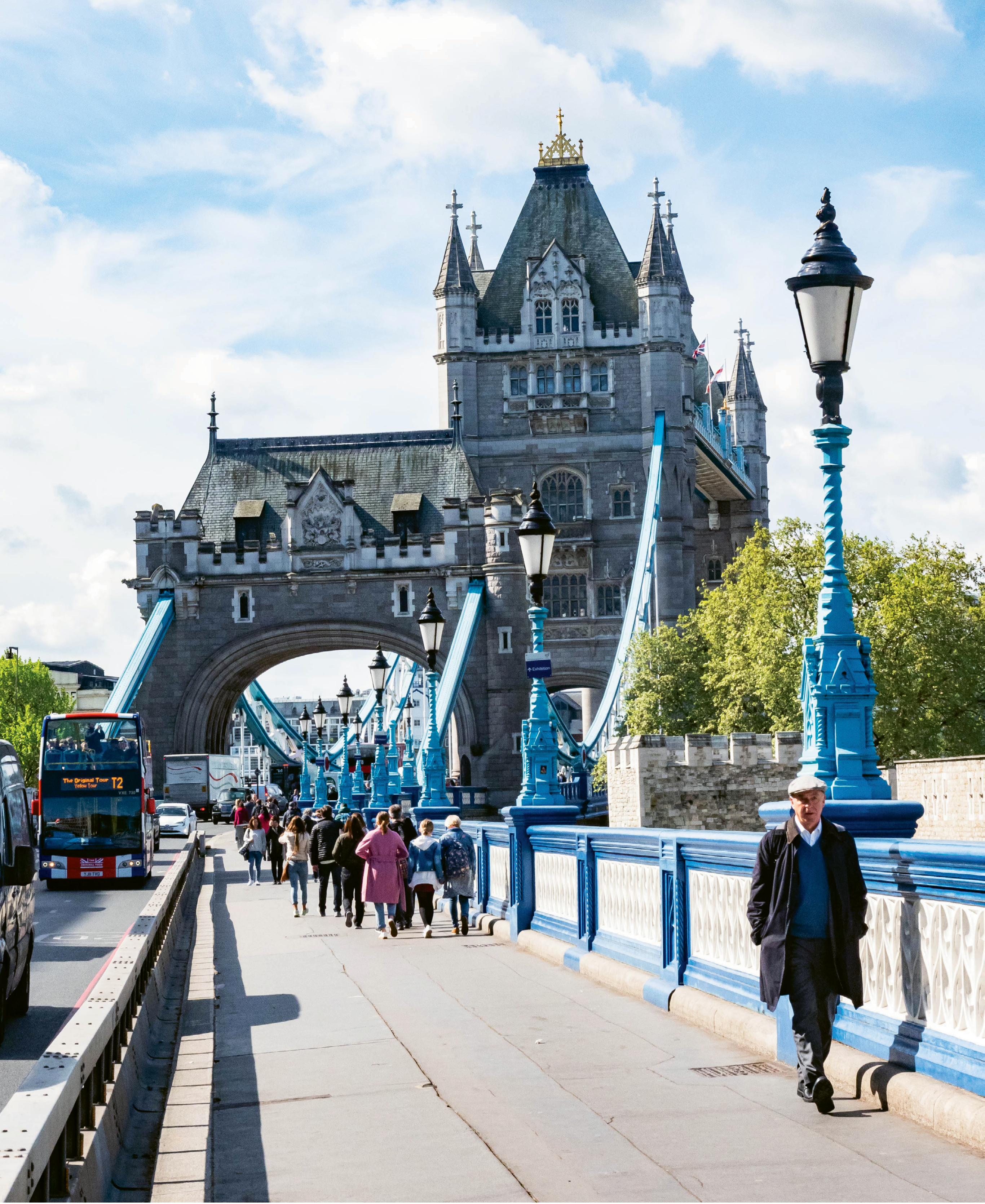 Walking the pedestrian path of the Tower Bridge, which spans the River Thames and is open for tours of the upper tier and engine room.