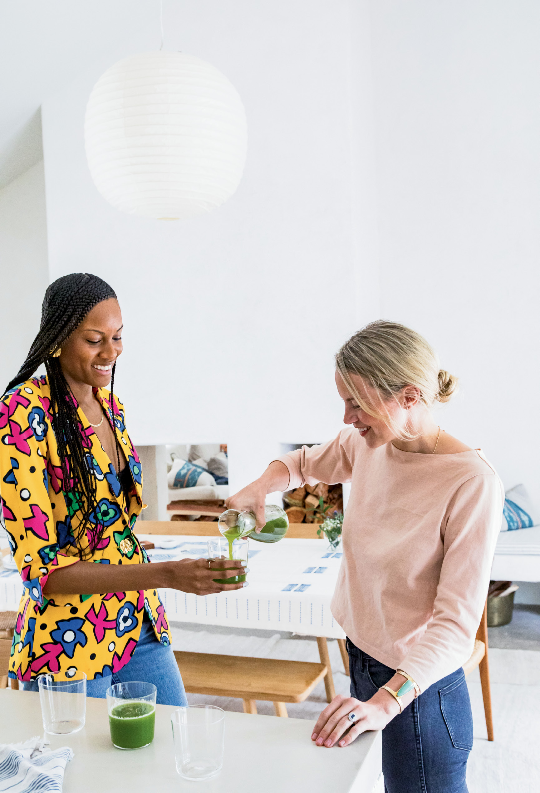 including Sabrina Hyman (left), cofounder of Ill Vibe The Tribe artist collective, and Kate Towill (right), co-owner of Basic Kitchen, who brought the restaurant’s freshly pressed Apples to Apples juice.